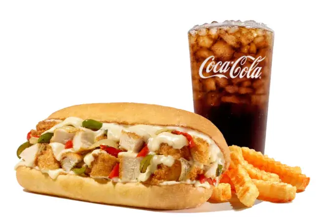 Fried chicken Philly sandwich with peppers, onions, and melted cheese, served with fries and a drink