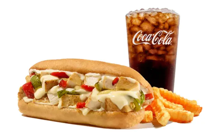 Grilled chicken Philly sandwich with peppers, onions, and melted cheese, served with fries and a drink