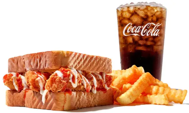 Golden crispy fried chicken sandwich with lettuce and tomatoes in a sesame bun