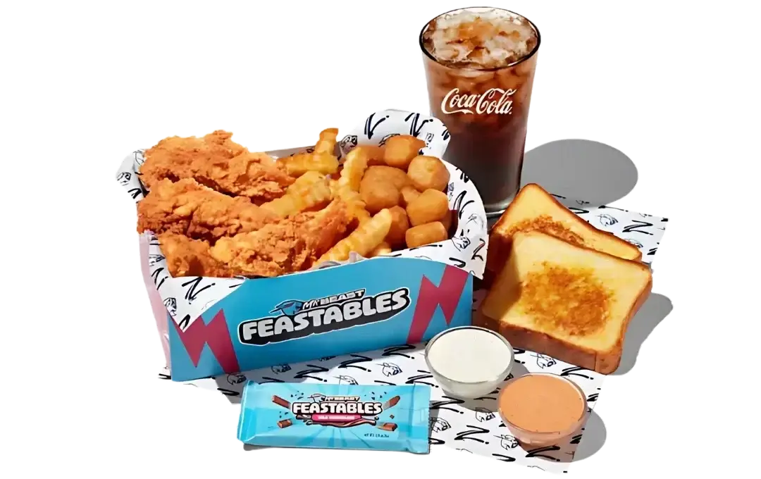 Colorful cardboard box with MrBeast logo containing assorted branded merchandise, snacks, and surprise items.