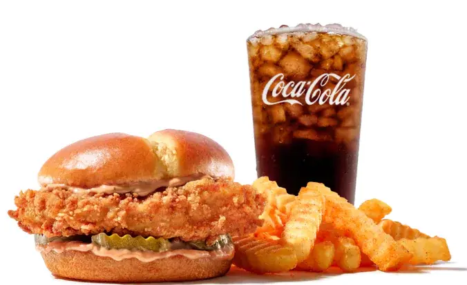 Grilled chicken sandwich with melted cheese, lettuce, tomatoes, and special sauce in a toasted bun