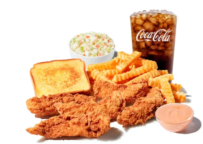 Plate of breaded chicken fingers with french fries, coleslaw, and dipping sauce containers on the side.
